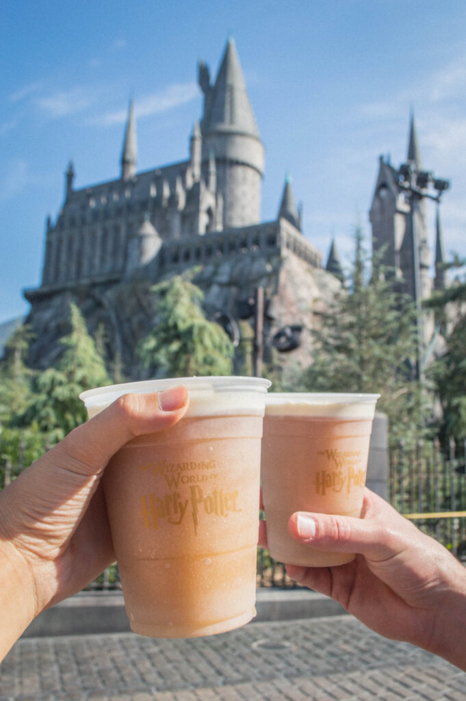 Butterbeer held in front of Hogwarts at Universal Studios Hollywood 